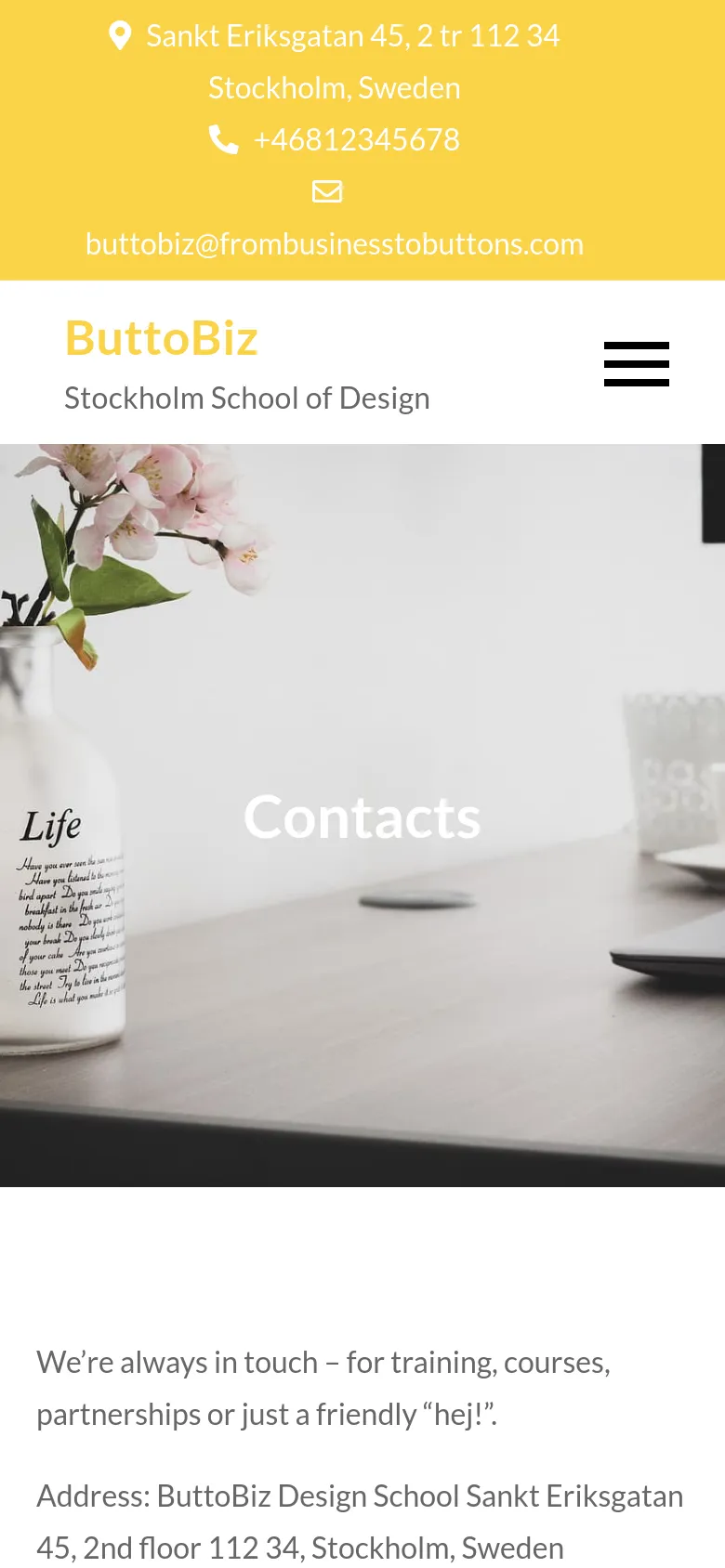 The mobile version presents a vertically stacked layout starting with a yellow header containing the address, phone, and email. Below this, the 'ButtoBiz' logo and a hamburger menu icon appear above a hero image of a desk setting with the word 'Contacts' overlaid. The contact information and introductory text follow in a single-column format below the image.