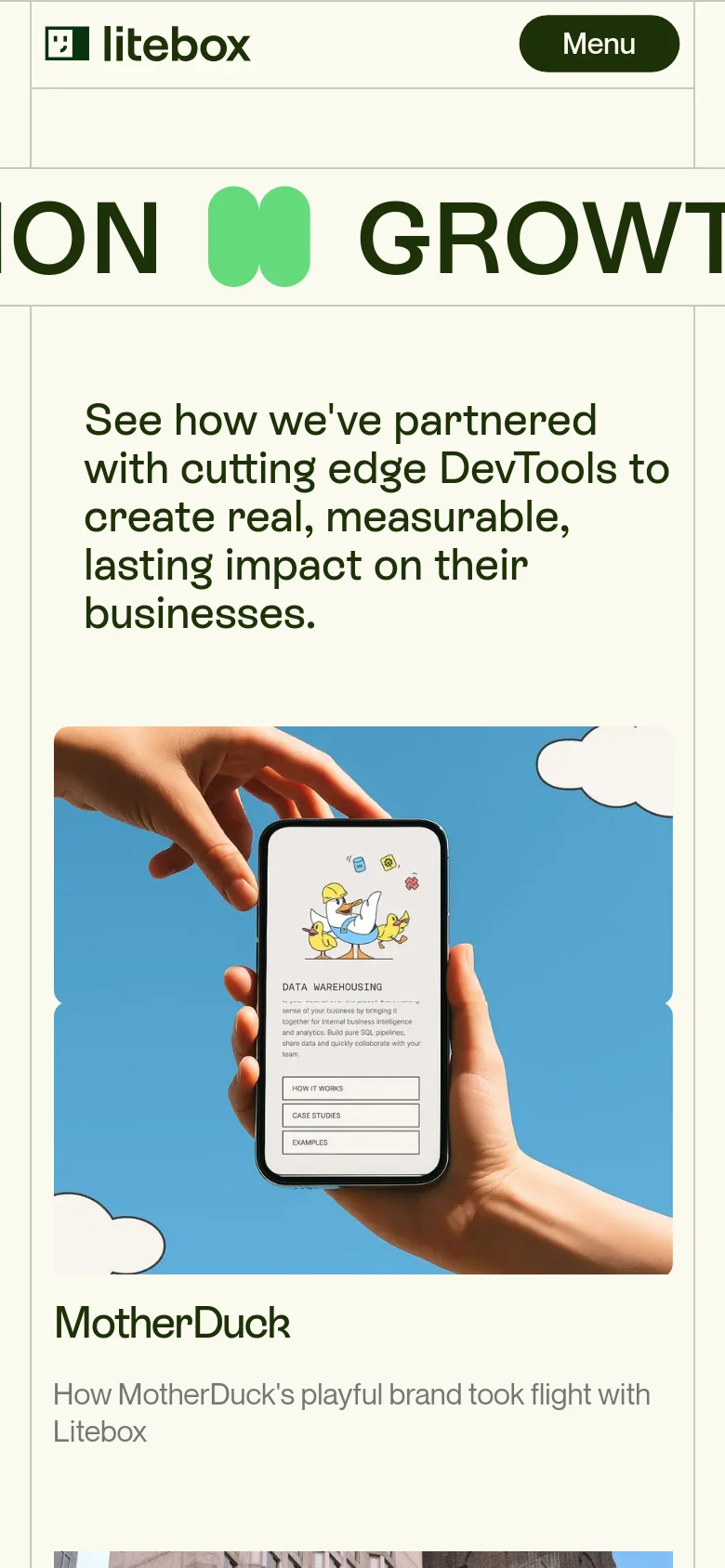 The mobile version uses a single-column vertical layout, stacking the large headline above the hero imagery. The navigation is condensed into a dark 'Menu' button at the top right, and the split-screen imagery from the desktop version is replaced by a single, large centered image of a hand holding a smartphone.