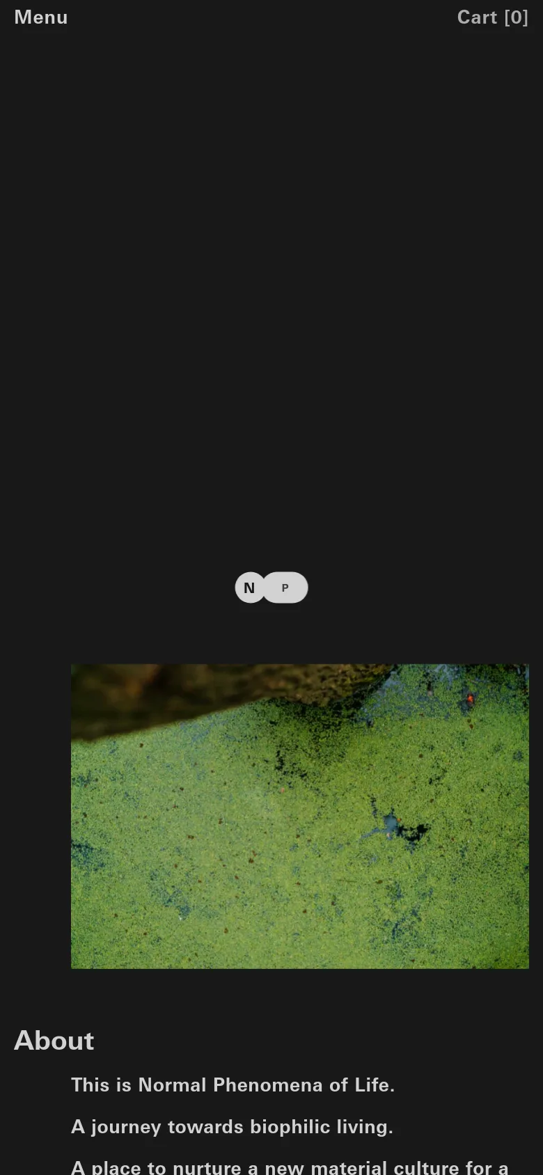 The mobile version maintains the dark charcoal theme but uses a condensed layout. The top navigation is replaced by a 'Menu' and 'Cart' header, and the text content is stacked vertically below a large, textured green biological imagery section.
