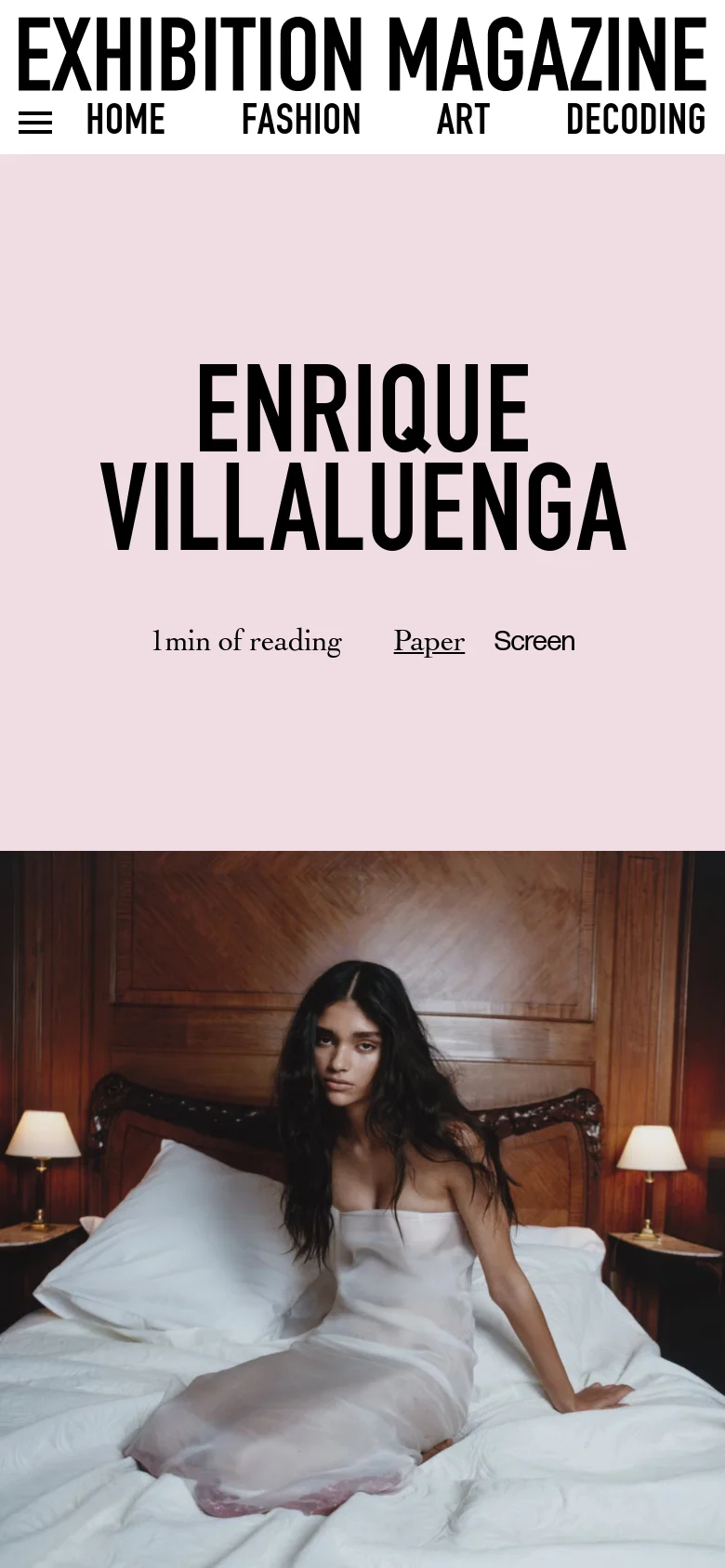 The mobile version of the page displays a vertically stacked layout. The large bold title 'ENRIQUE VILLALUENGA' appears first against a light pink background, followed by the reading time and the hero image of a woman on a bed. The top navigation is condensed into a hamburger menu icon.