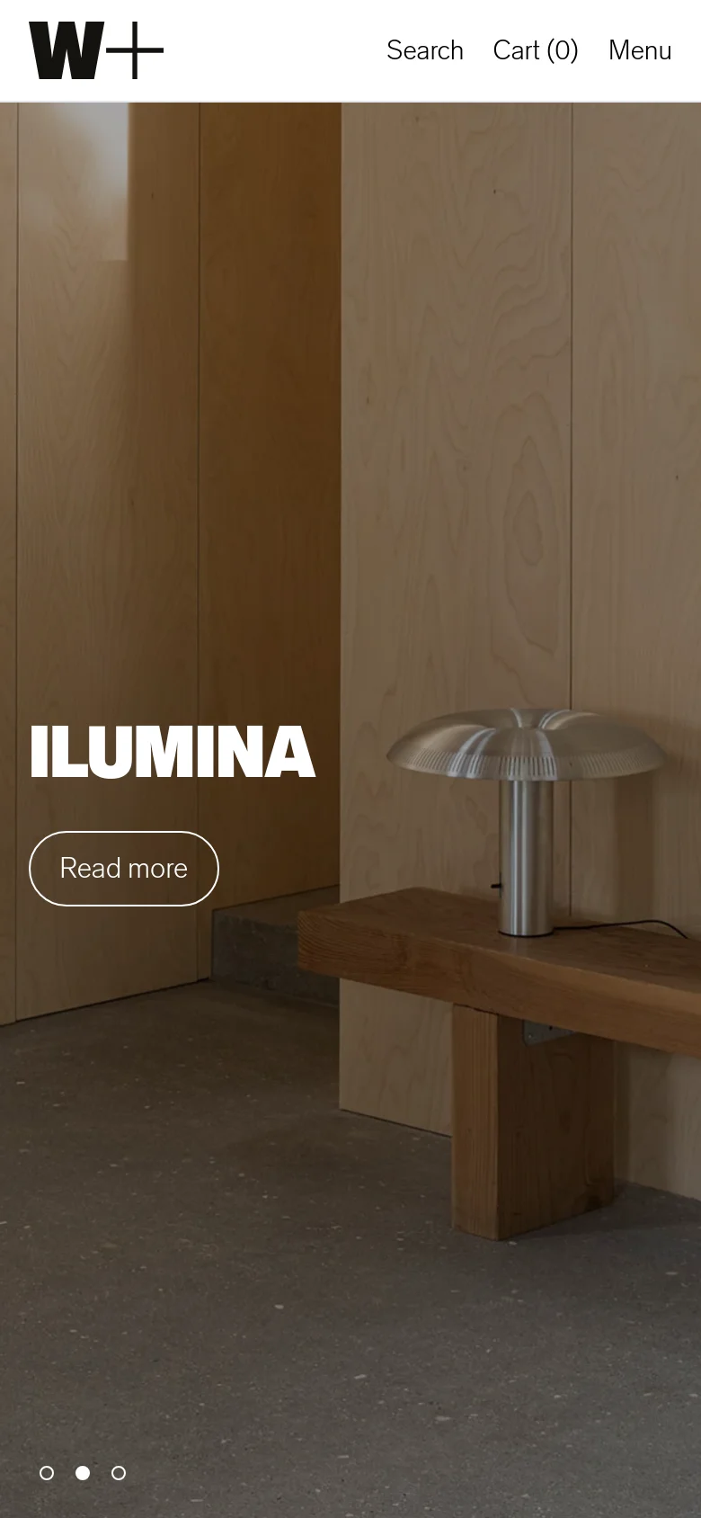 The mobile version presents a vertically stacked layout, focusing on the large hero image of the ILUMINA lamp. The navigation is condensed into a 'Menu' link alongside 'Search' and 'Cart (0)' at the top, while the hero image occupies the full width of the screen with a 'Read more' button.