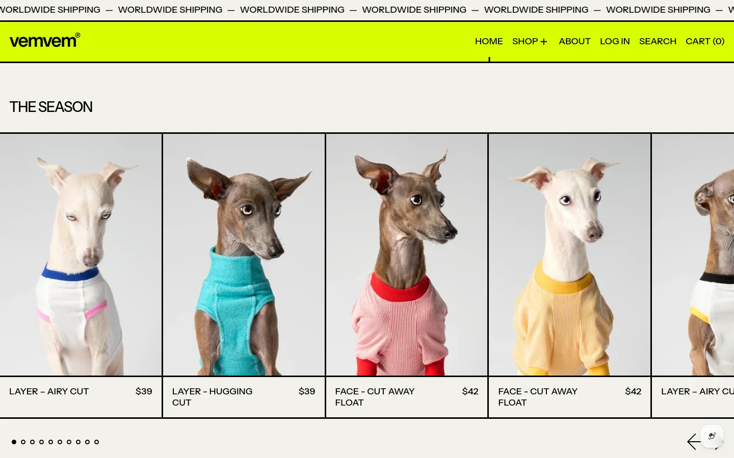 The desktop homepage for vemvem features a bright lime green header with a navigation menu including Home, Shop, About, Log In, Search, and Cart. Below a scrolling 'Worldwide Shipping' banner, 'THE SEASON' section displays a horizontal grid of high-end functional clothing for Italian Greyhounds, showing dogs in colorful ribbed sweaters against a light grey background. Each product image is accompanied by its name and price, such as 'LAYER – AIRY CUT $39'.