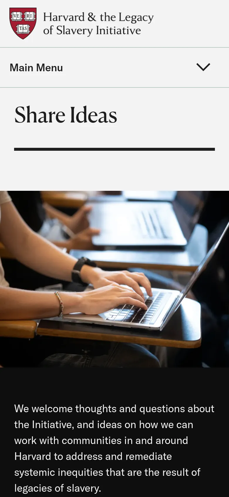 The mobile version uses a simplified layout with a 'Main Menu' accordion dropdown at the top. The 'Share Ideas' heading and hero image are stacked vertically, with the text content appearing below the large image of hands using a laptop.