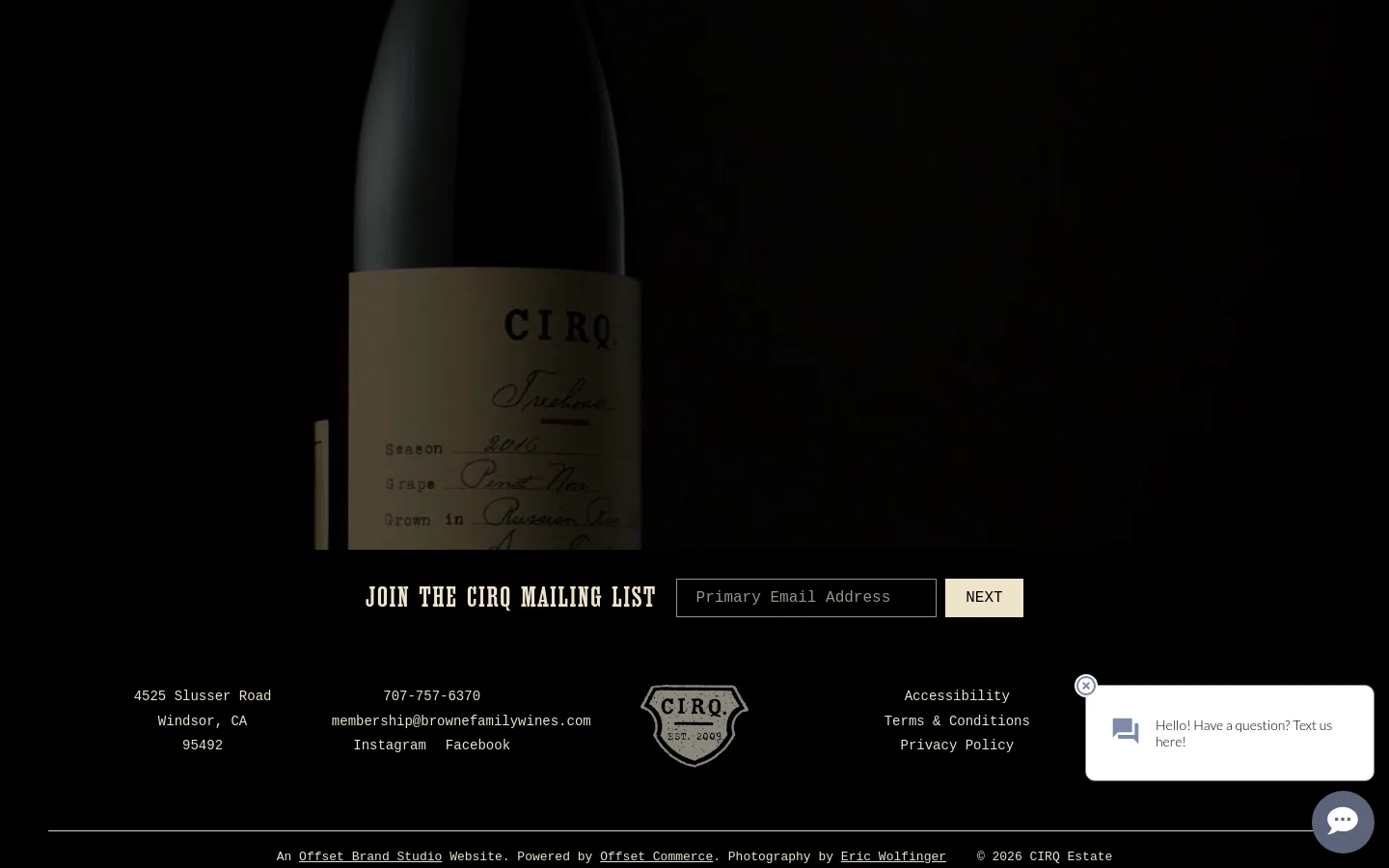 The CIRQ homepage features a dark, minimalist design with a large hero image of a wine bottle label against a black background. A prominent headline reads 'JOIN THE CIRQ MAILING LIST' above an email input field and a 'NEXT' button. The footer contains contact information, social media links, and the CIRQ logo.