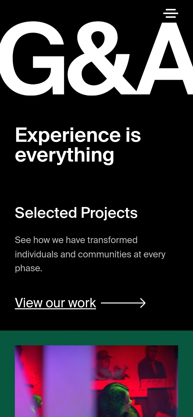 The mobile version maintains the high-contrast black and white theme, featuring the large 'G&A' logo and 'Experience is everything' headline at the top. The layout shifts to a single-column vertical scroll, presenting the 'Selected Projects' section and 'View our work' link in a stacked format optimized for smaller screens.