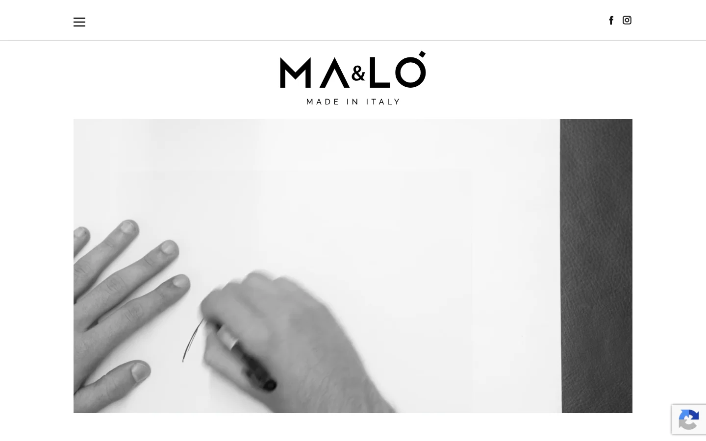 The desktop page features a minimalist white background with the black MA&LÒ MADE IN ITALY logo centered at the top. Below the logo is a large, wide-format black and white hero image showing hands working on a design or material. The layout is spacious, with navigation links and social media icons positioned at the top corners.