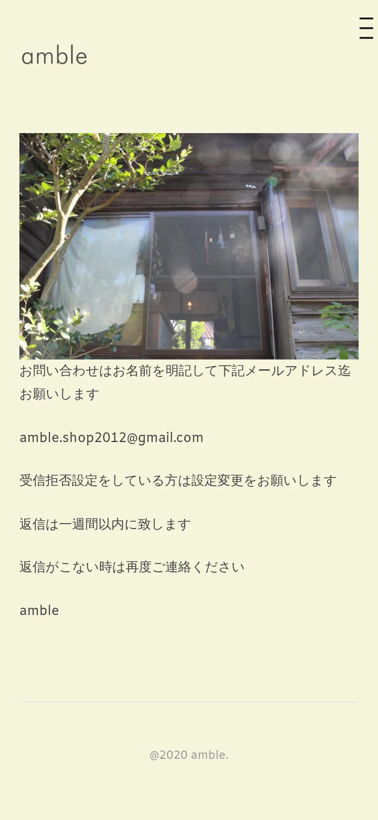 The mobile version simplifies the layout, replacing the top navigation bar with a hamburger menu icon on the right. The hero image and contact text are stacked vertically, maintaining the cream color scheme and centered alignment for readability on a smaller screen.
