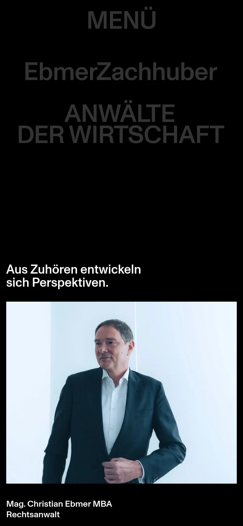 EbmerZachhuber team page with a mobile-responsive stacked layout. The dark minimalist design reflows the team profiles into a single column, presenting portraits, names, and professional biographies in a vertical scroll.