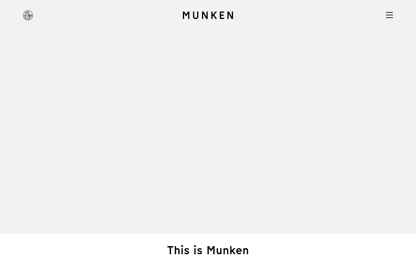 The desktop page features a minimalist design with a large hero video area at the top, showing a close-up of textured paper. Below, the headline 'This is Munken' is displayed in a bold, black sans-serif font against a clean white background, followed by descriptive text about the mill's history and location.