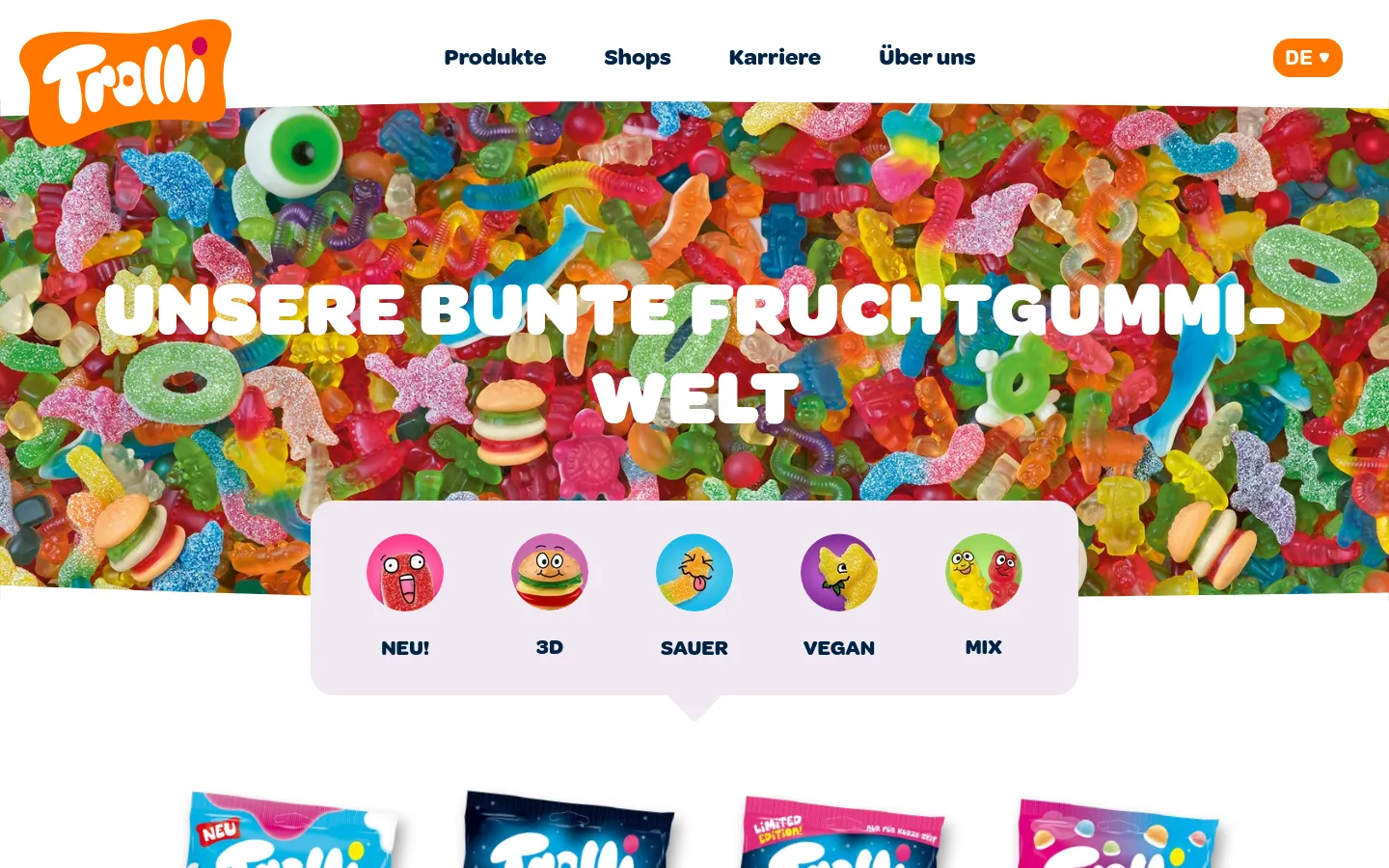 The desktop page features a white navigation bar with the Trolli logo and links for Produkte, Shops, Karriere, and Über uns. A large hero image shows a colorful sea of gummy candies with the headline 'UNSERE BUNTE FRUCHTGUMMI-WELT' in bold white text. Below the hero, a white floating card contains circular icons for product categories: NEU!, 3D, SAUER, VEGAN, and MIX.