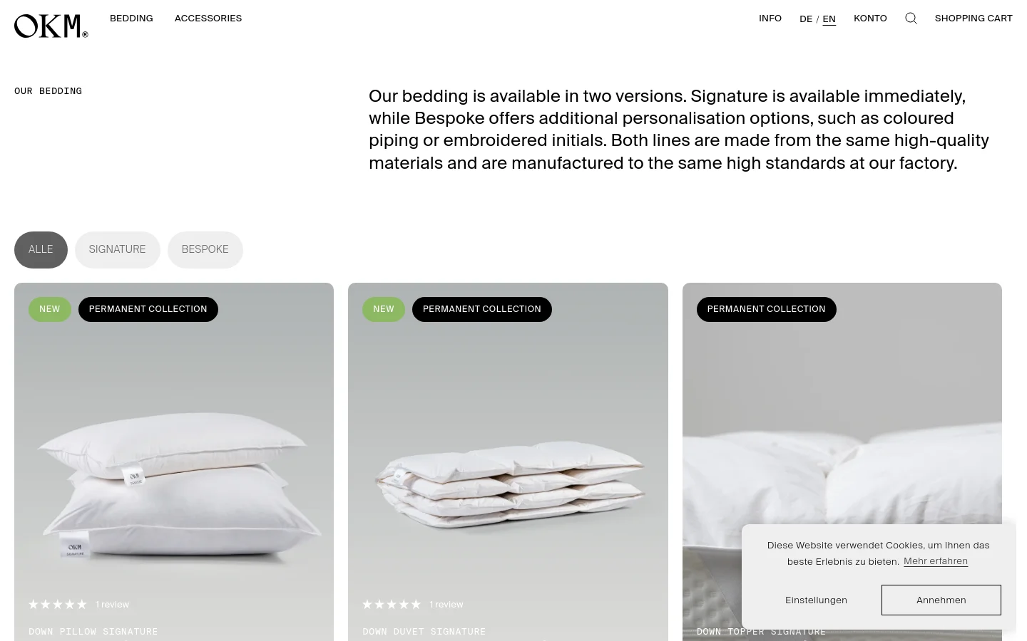 The desktop page features a clean, minimalist layout with a white background and black text. A large headline introduces the bedding collections, followed by three pill-shaped filter buttons: 'ALLE', 'SIGNATURE', and 'BESPOKE'. Below, a grid of product cards displays high-quality images of white pillows and duvets, each with labels like 'NEW' or 'PERMANENT COLLECTION' and pricing information.