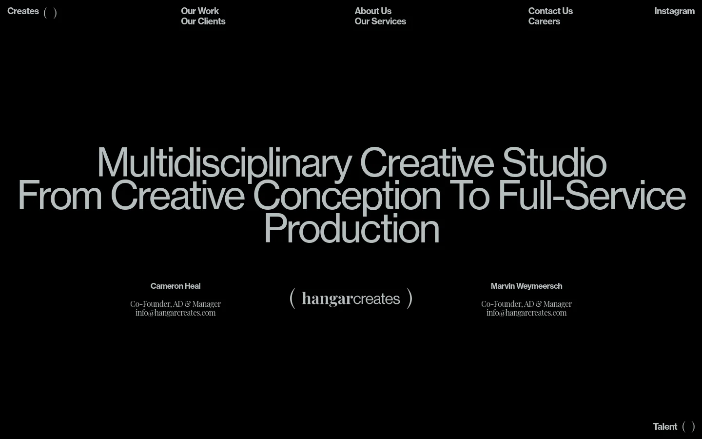 The desktop About Us page features a minimalist black background with large, bold white typography. The headline reads 'Multidisciplinary Creative Studio From Creative Conception To Full-Service Production,' followed by the names, titles, and email addresses of co-founders Cameron Heal and Marvin Weymeersch arranged in two columns. A navigation menu is located at the top, and the studio logo is centered near the bottom.