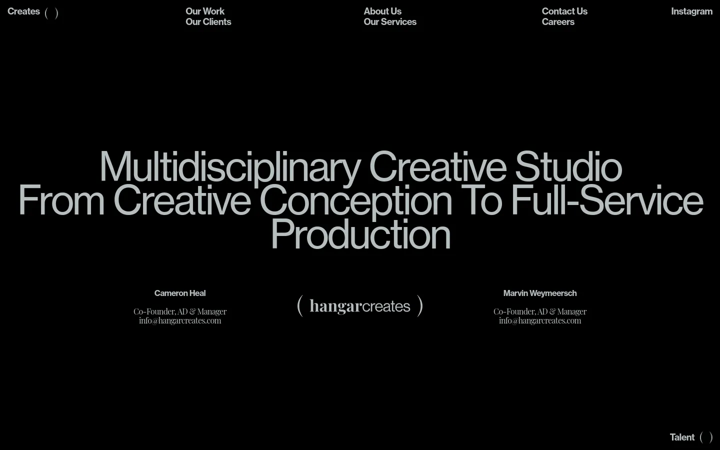 The desktop About Us page features a minimalist black background with large, bold white typography. The headline reads 'Multidisciplinary Creative Studio From Creative Conception To Full-Service Production,' followed by the names, titles, and email addresses of co-founders Cameron Heal and Marvin Weymeersch arranged in two columns. A navigation menu is located at the top, and the studio logo is centered near the bottom.