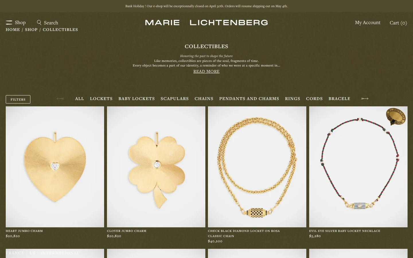 The desktop page for Marie Lichtenberg's Collectibles collection features a dark olive green background with centered white text including the title and a poetic description. Below the header, a horizontal navigation bar offers categories like Lockets and Rings, followed by a grid of high-end gold jewelry products displayed against light grey backgrounds. The layout is spacious and minimalist, with a top navigation bar containing the brand logo, search, and account links.