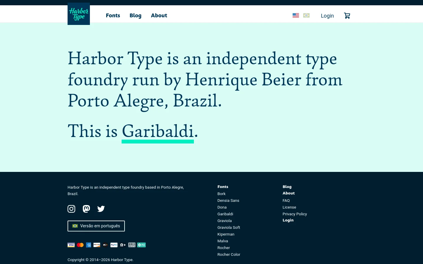 The desktop homepage features a minimalist design with a light mint green background and dark navy text. A large serif headline introduces the foundry and highlights the Garibaldi font, while the navigation bar includes links for Fonts, Blog, and About, along with language selectors and a shopping cart. The footer contains site navigation links, social media icons, and accepted payment methods against a dark navy background.