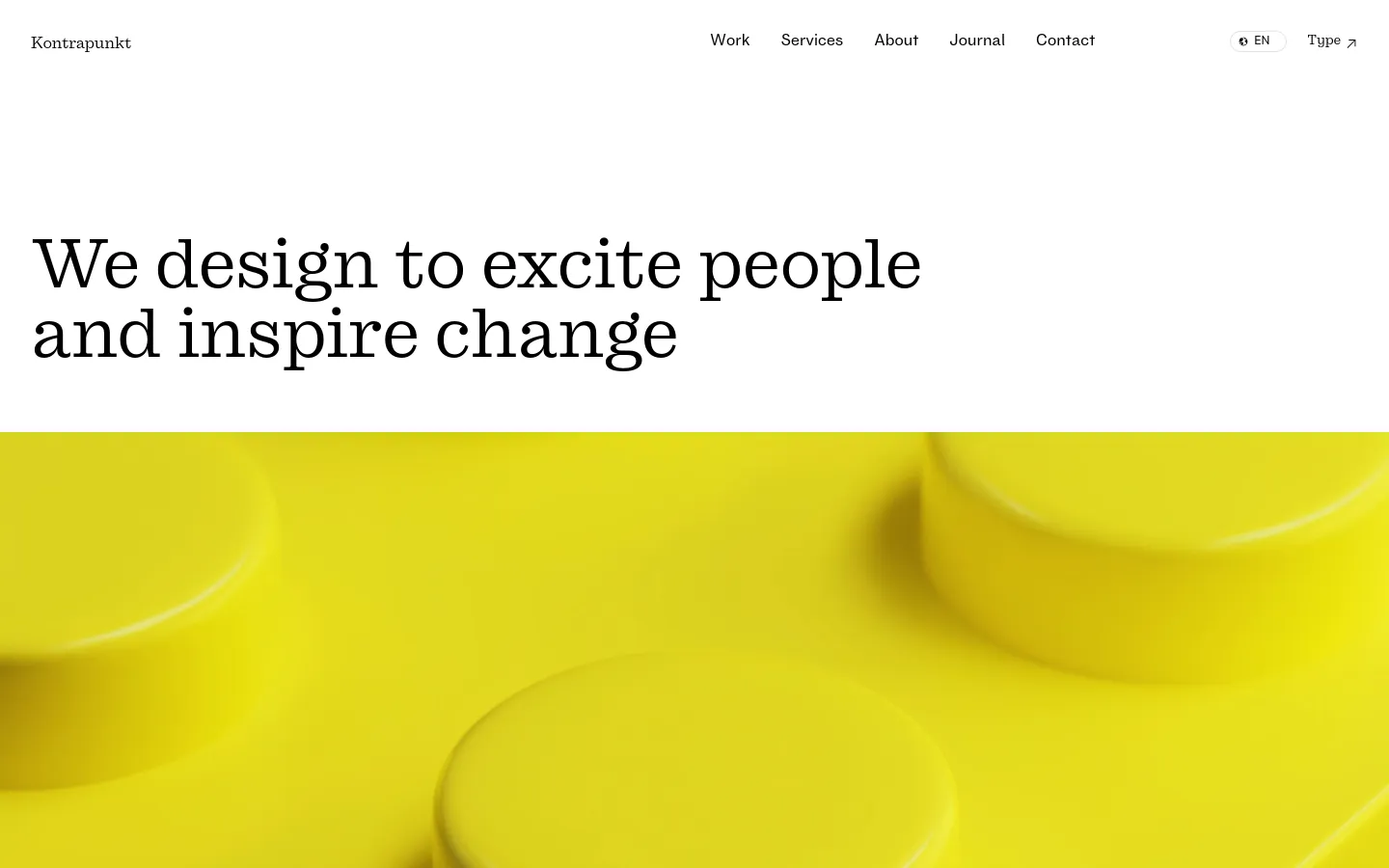 The desktop homepage features a minimalist white background with a large serif headline, 'We design to excite people and inspire change.' Below the headline is a vibrant hero image of bright yellow geometric cylinders. A navigation menu is at the top right, and an 'About us' call to action with an arrow icon follows the introductory text.