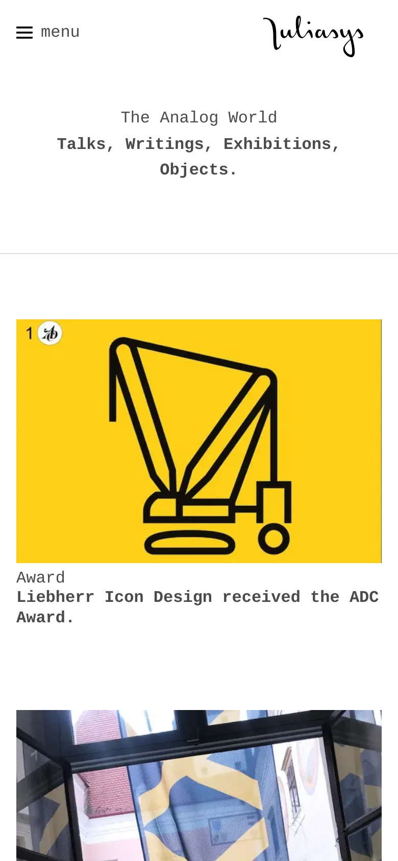 The mobile version uses a simplified layout with a hamburger menu icon and the 'juliasys' logo at the top. The hero text is centered, and the content shifts to a single-column vertical stack, starting with a large yellow card featuring a black icon and award description.