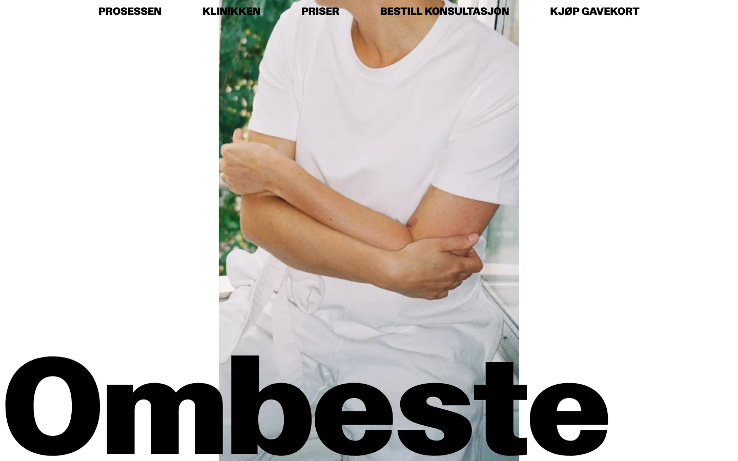 The desktop homepage features a minimalist design with a large hero image of a person in white clothing against a light background. The brand name 'Ombestem' is displayed in large, bold black typography at the bottom, with a navigation menu at the top containing links for Process, Clinic, Prices, Book Consultation, and Buy Gift Card.