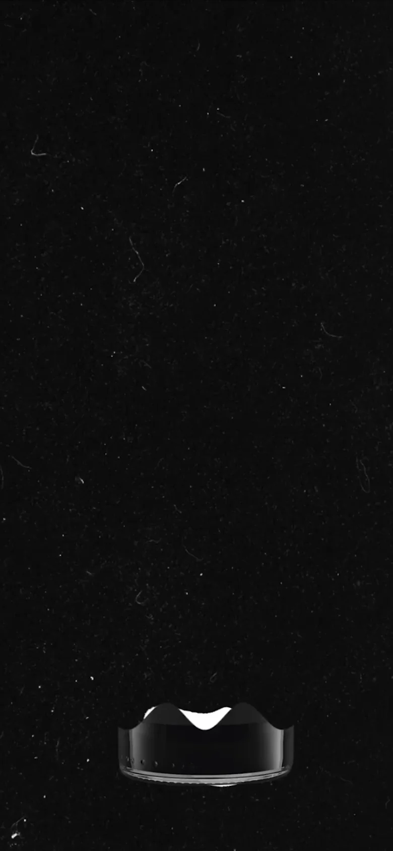 The mobile version maintains the minimalist black and white aesthetic but collapses the navigation into a simplified layout. The vertical photographic panels are stacked or scaled to fit the narrow viewport, focusing on the high-contrast imagery.