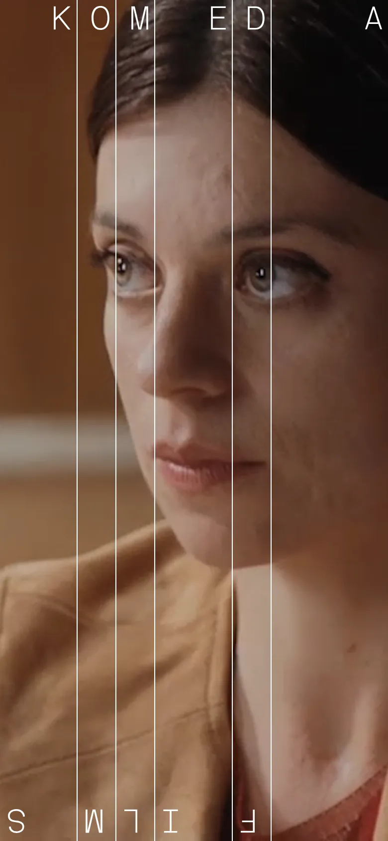The mobile version maintains the vertical imagery style but stacks the content vertically to fit the narrow screen. The large typography of 'KOMEDA FILMS' is rearranged, with letters appearing in a single column or smaller clusters over the portrait, and the 'See all films' link remains a primary navigational element.