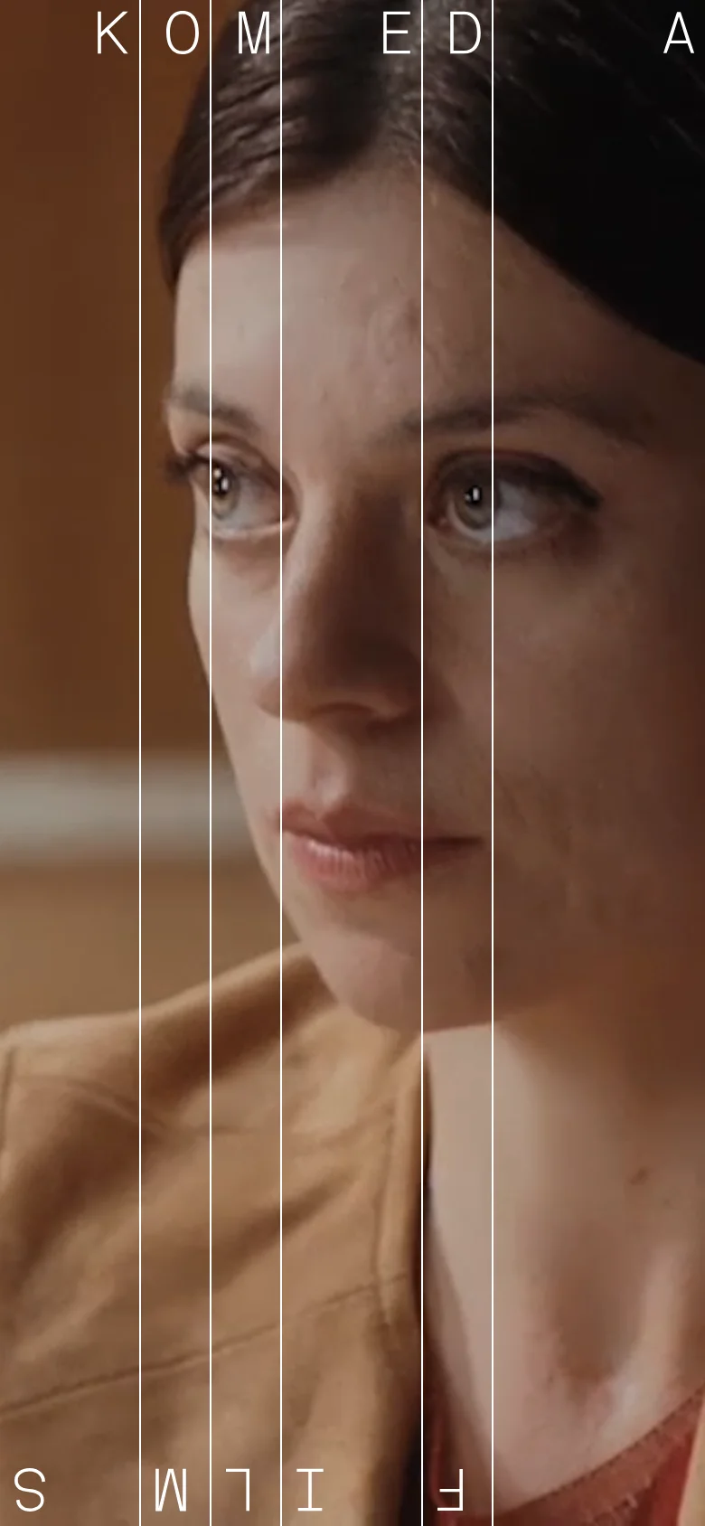 The mobile version maintains the vertical imagery style but stacks the content vertically to fit the narrow screen. The large typography of 'KOMEDA FILMS' is rearranged, with letters appearing in a single column or smaller clusters over the portrait, and the 'See all films' link remains a primary navigational element.