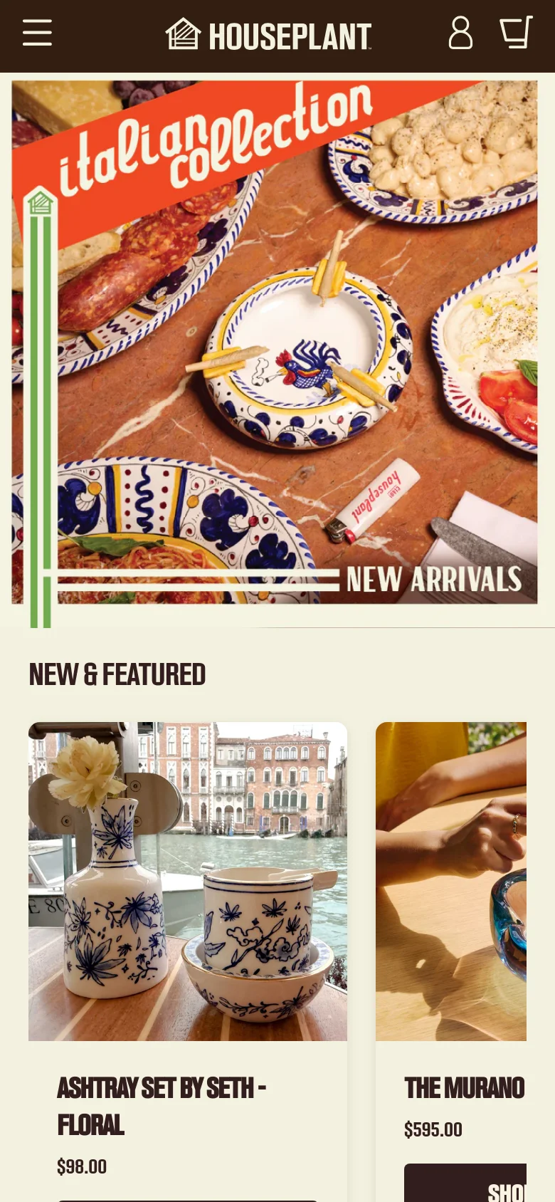 The mobile version presents a vertically stacked layout, starting with a full-width hero image featuring the 'italian collection' text and food imagery. The 'NEW & FEATURED' section follows, displaying products in a single-column vertical scroll rather than a multi-column grid. The navigation header is simplified with a hamburger menu, logo, user icon, and shopping cart icon.