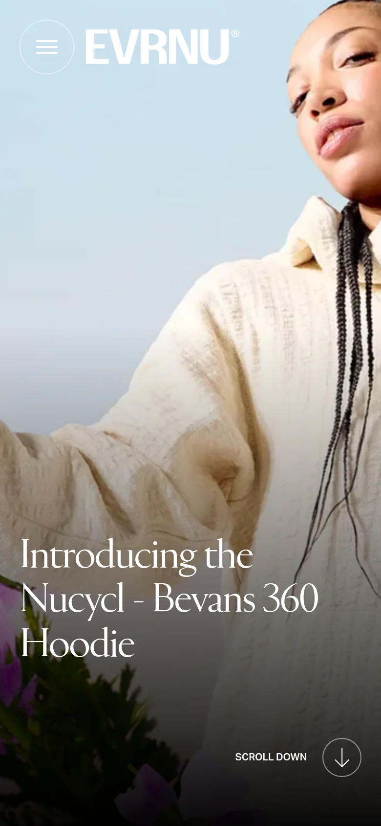 The mobile version presents a vertically oriented, cropped version of the hero image, focusing closely on the person's face and the hoodie. The headline text is centered and stacked vertically to fit the narrow screen, and the 'Scroll Down' arrow icon is positioned at the bottom right for easy navigation.