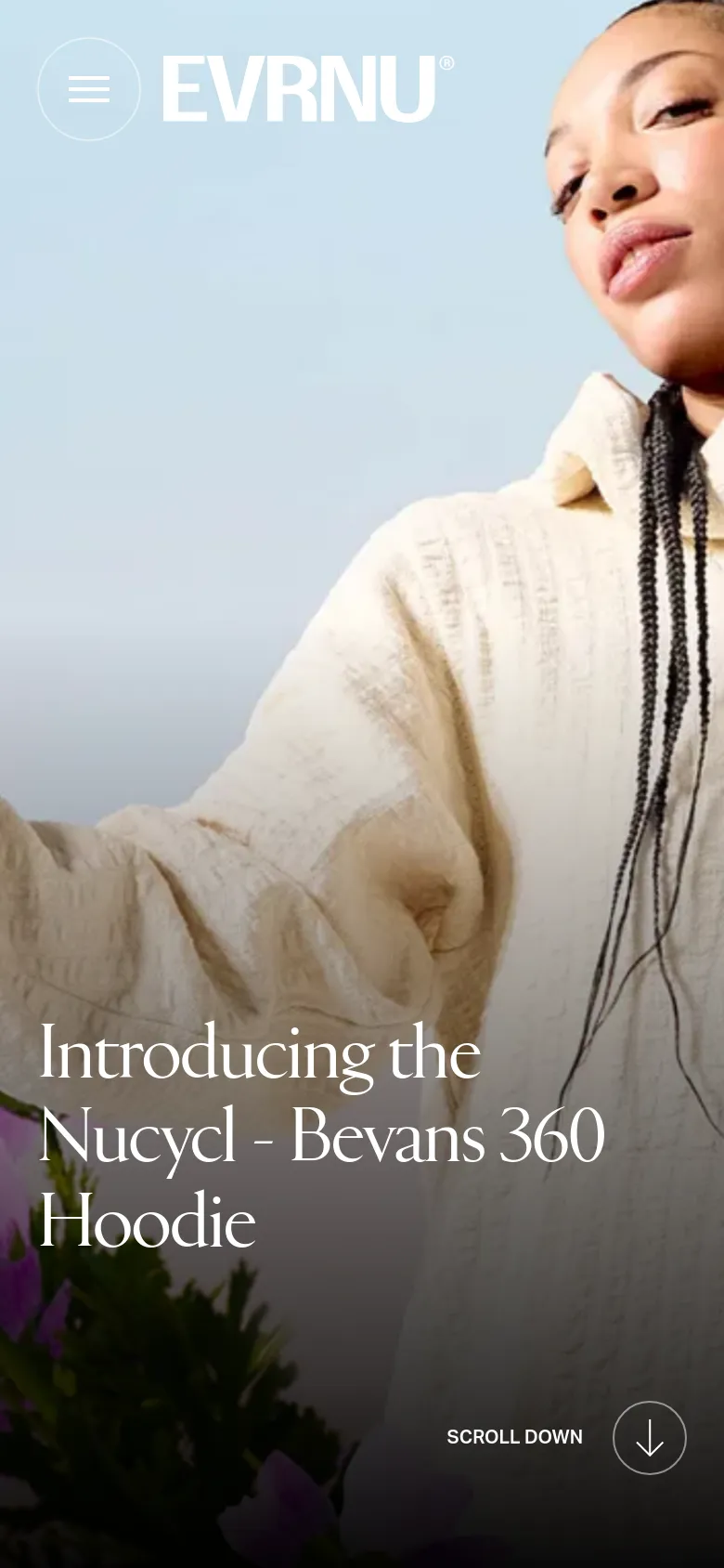 The mobile version presents a vertically oriented, cropped version of the hero image, focusing closely on the person's face and the hoodie. The headline text is centered and stacked vertically to fit the narrow screen, and the 'Scroll Down' arrow icon is positioned at the bottom right for easy navigation.