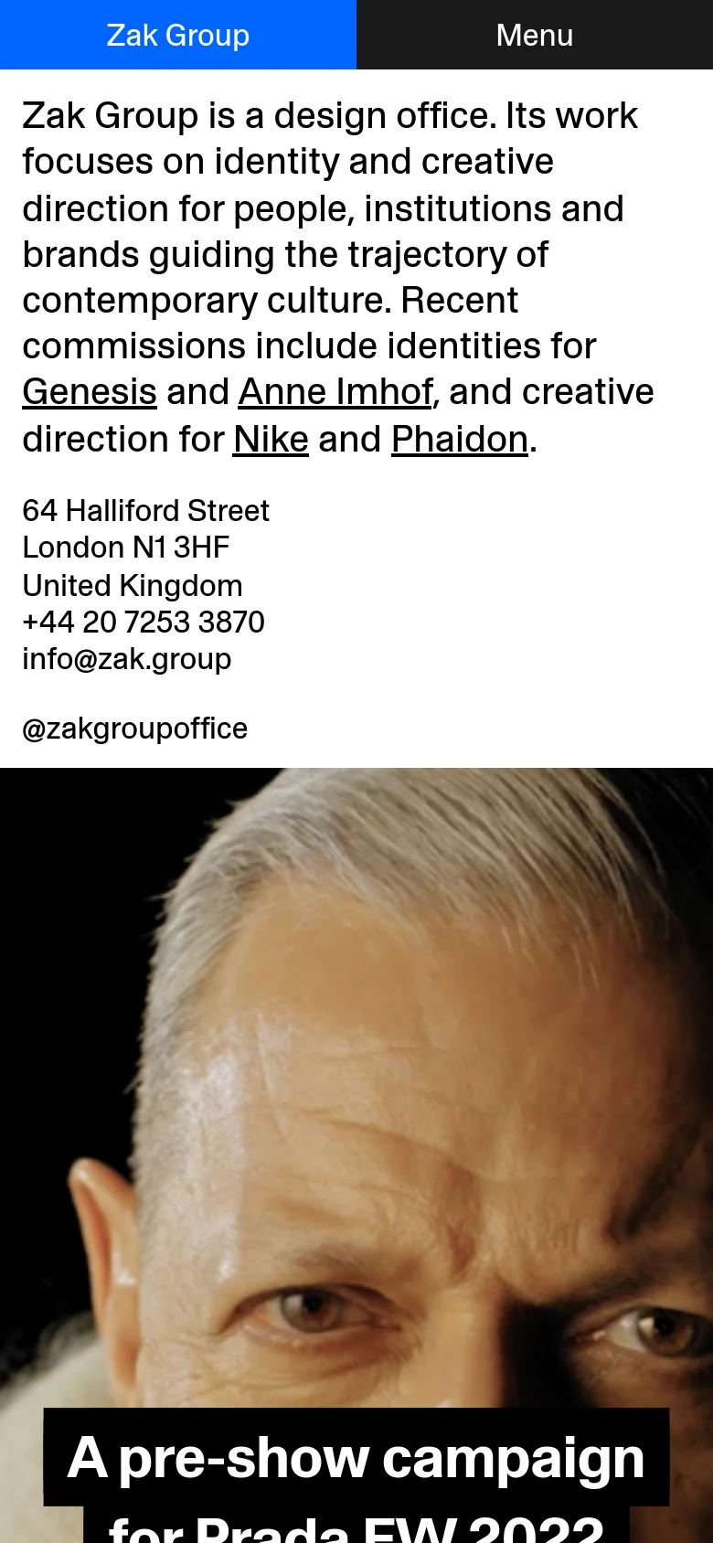 The mobile version uses a simplified vertical layout with a dark header containing 'Zak Group' and a 'Menu' button. The introductory text and contact details are stacked vertically, followed by a full-width hero image of a person's face with the text 'A pre-show campaign for Prada FW 2022' in a black box.