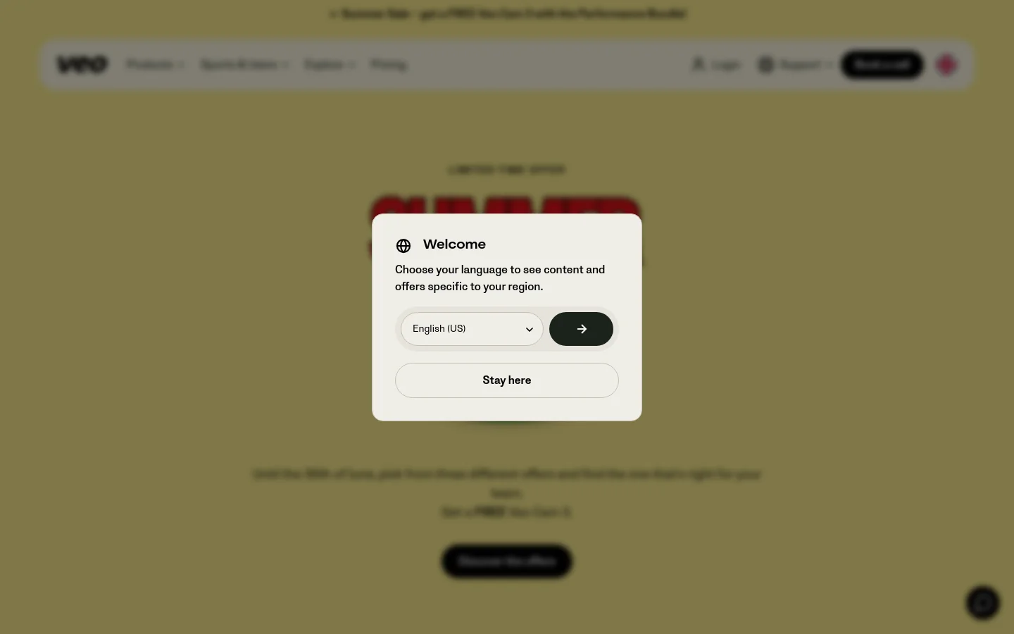 The desktop homepage features a light yellow background with a centered 'Summer Sale' promotional overlay. A white modal window titled 'Welcome' asks users to choose their language, featuring a dropdown menu and a black arrow button, with a 'Stay here' button below. The background shows a large, blurred red headline and a black 'Discover the offers' call-to-action button.