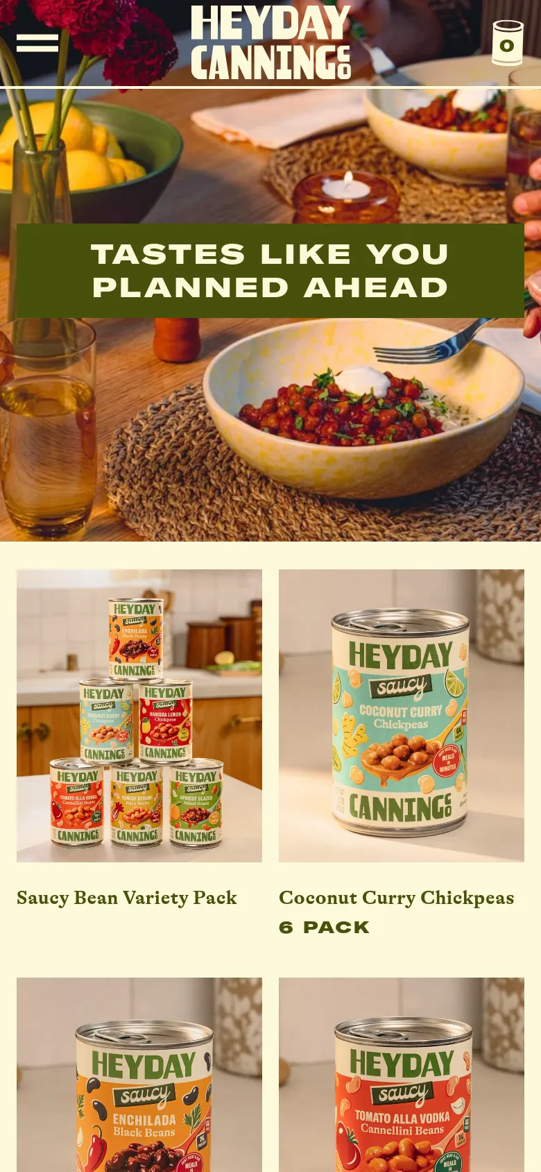 The mobile version presents a vertically stacked layout, starting with a full-width hero image and the same green headline banner. The product collection grid shifts to a single-column view, showing large product images for the Saucy Bean Variety Pack and Coconut Curry Chickpeas. A simplified navigation menu is indicated by a hamburger icon and a shopping bag icon at the bottom of the hero section.