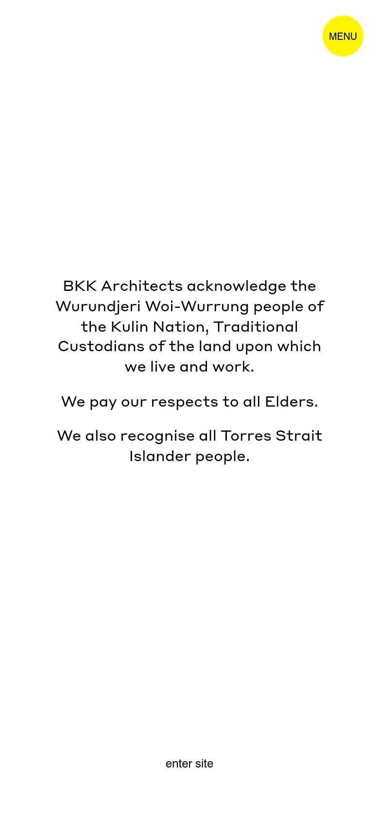 The mobile version maintains the minimalist aesthetic with centered black text on a white background. The layout is vertically oriented, featuring the same land acknowledgment and 'enter site' link, with the yellow 'MENU' button positioned at the top right.