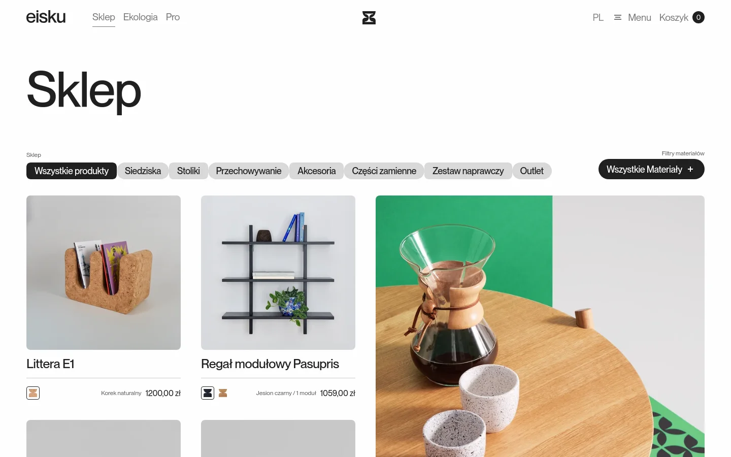 The desktop shop page features a large 'Sklep' headline on a white background with a horizontal navigation menu and filter buttons for product categories like 'Siedziska' and 'Stoliki'. Below the filters, a grid displays product cards with images, names, and prices, such as a cork letter holder and a black modular shelf. The color palette is minimalist with white, black, and natural wood tones.