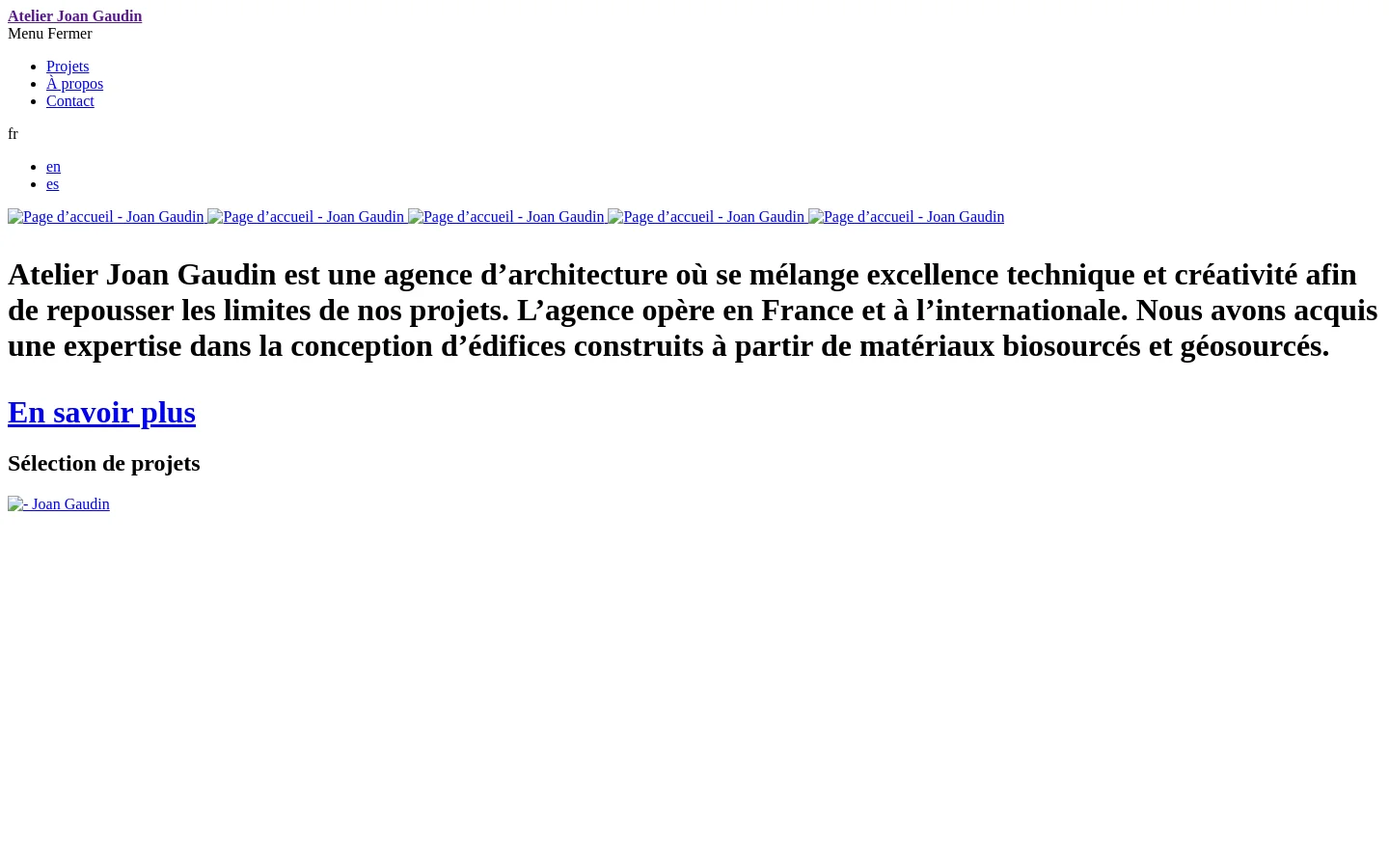 The desktop homepage for Joan Gaudin architecture features a minimalist design with a large hero image of a stone architectural structure. A bold headline describes the agency's blend of technical excellence and creativity, followed by an 'En savoir plus' call to action. The layout includes a navigation menu with links to Projects, About, and Contact, set against a clean, light background.