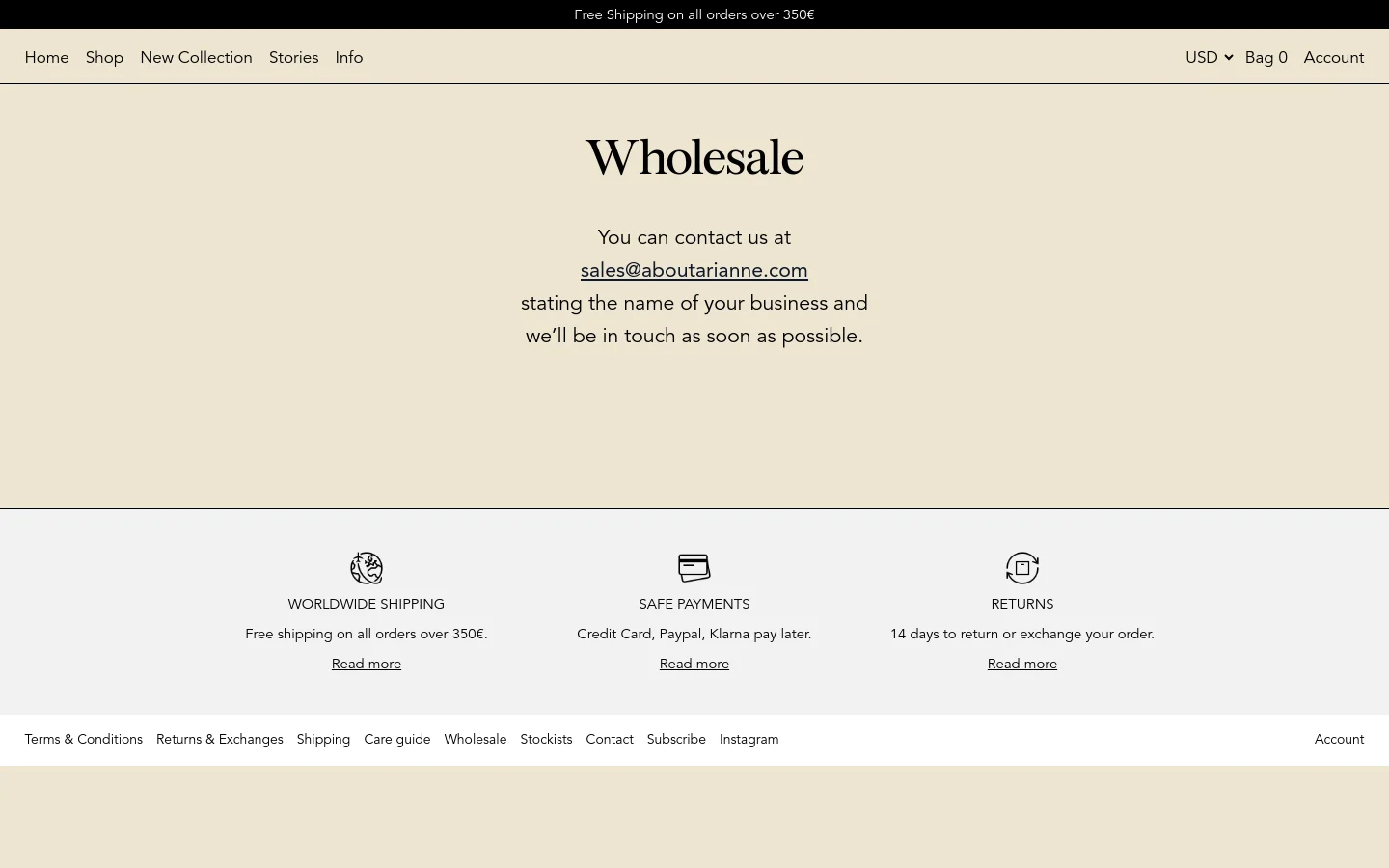 The desktop wholesale page features a minimalist design with a cream background and black serif typography. A central heading reads 'Wholesale' above contact instructions including a clickable email link, followed by a three-column section highlighting worldwide shipping, safe payments, and returns. The top navigation bar includes links for Home, Shop, New Collection, Stories, and Info, alongside currency and account options.