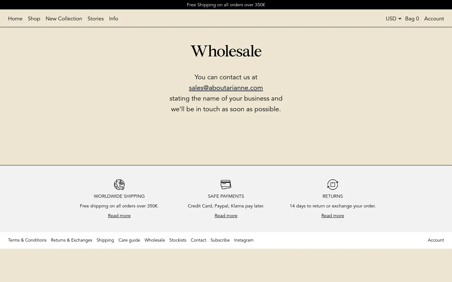 The desktop wholesale page features a minimalist design with a cream background and black serif typography. A central heading reads 'Wholesale' above contact instructions including a clickable email link, followed by a three-column section highlighting worldwide shipping, safe payments, and returns. The top navigation bar includes links for Home, Shop, New Collection, Stories, and Info, alongside currency and account options.