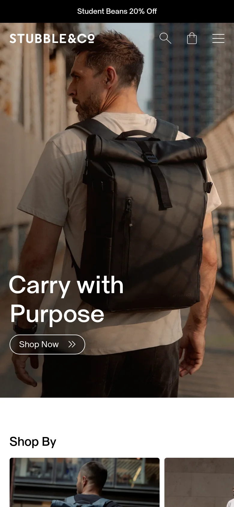 The mobile version shows a vertically oriented hero image of a man with a black backpack, with the headline 'Carry with Purpose' and 'Shop Now' button centered lower on the screen. The navigation is condensed into a hamburger menu icon next to a search icon and shopping bag icon at the top.