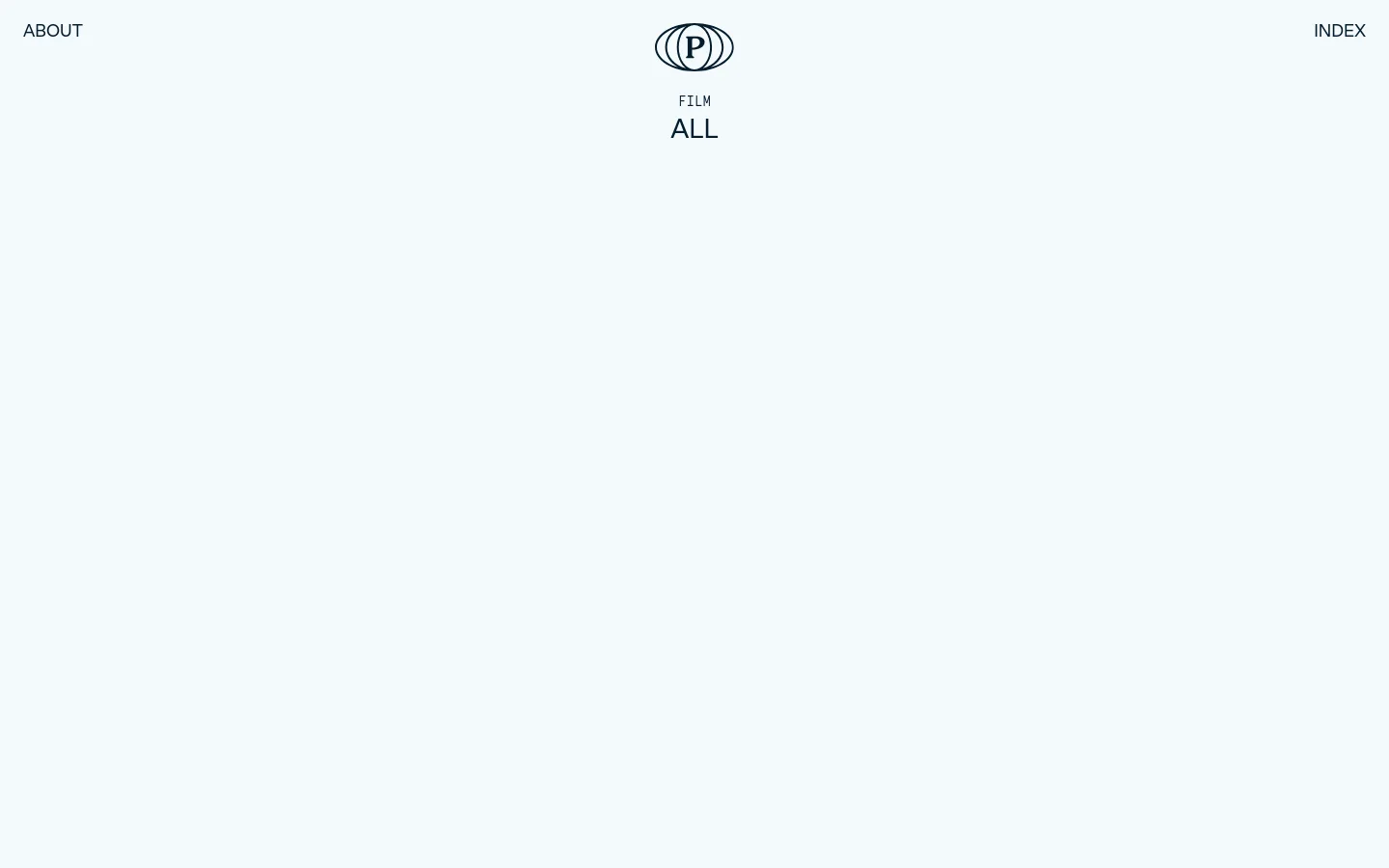 The desktop archive page features a minimalist white layout with a centered logo and navigation links for 'ABOUT' and 'INDEX'. Below the 'ALL' heading, a grid of large, high-quality cinematic images showcases various film and photography projects, each accompanied by a title and client name. The design uses ample whitespace and clean typography to highlight the visual portfolio.