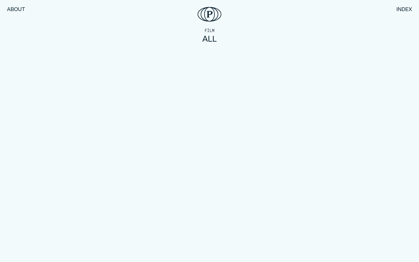 The desktop archive page features a minimalist white layout with a centered logo and navigation links for 'ABOUT' and 'INDEX'. Below the 'ALL' heading, a grid of large, high-quality cinematic images showcases various film and photography projects, each accompanied by a title and client name. The design uses ample whitespace and clean typography to highlight the visual portfolio.