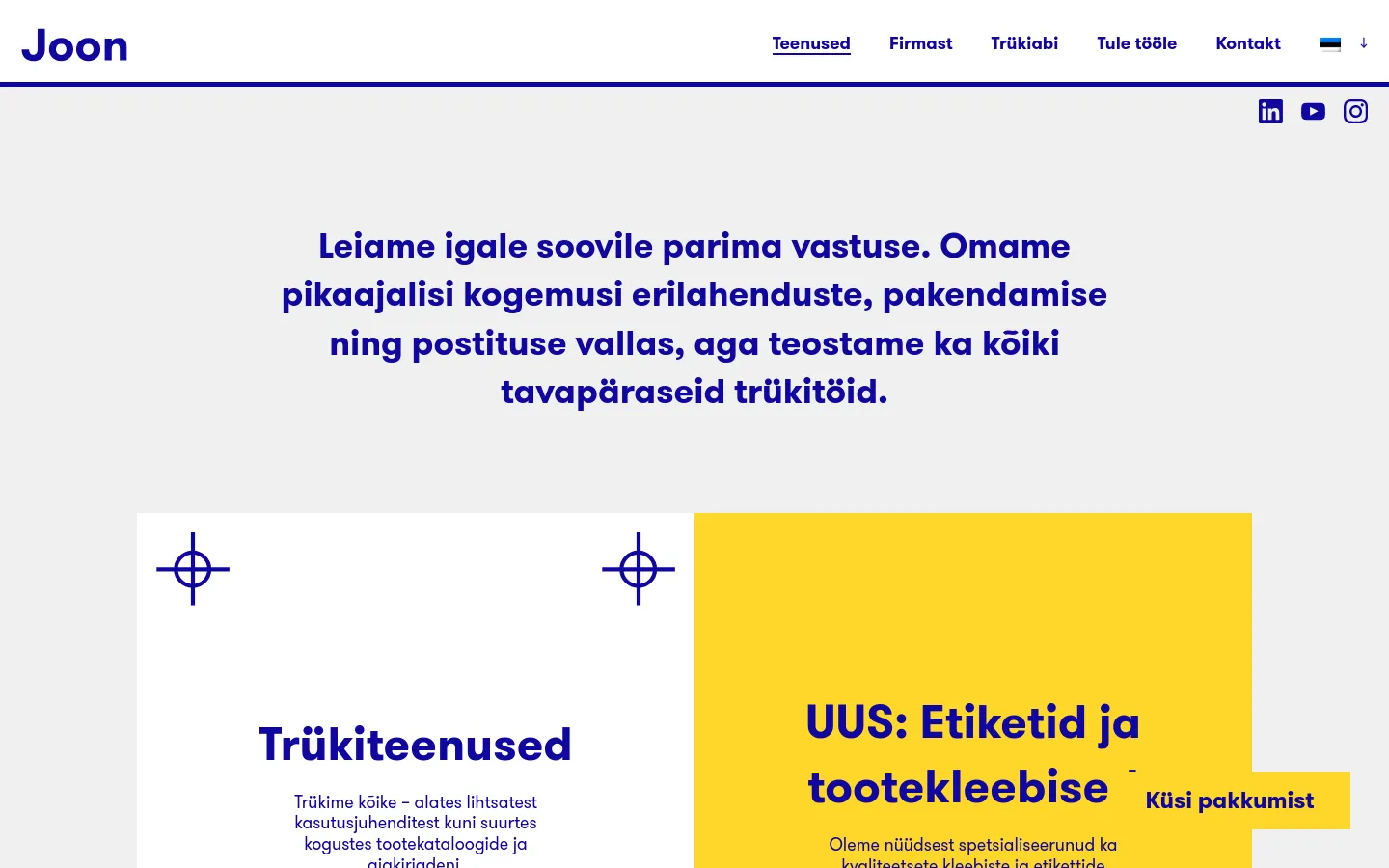 The desktop website features a clean white and yellow layout with dark blue text. A large hero headline introduces the company's services, followed by a grid of service categories including Printing Services, Labels and Product Stickers, Packaging, and Packaging Prototyping, each accompanied by minimalist blue crosshair icons.