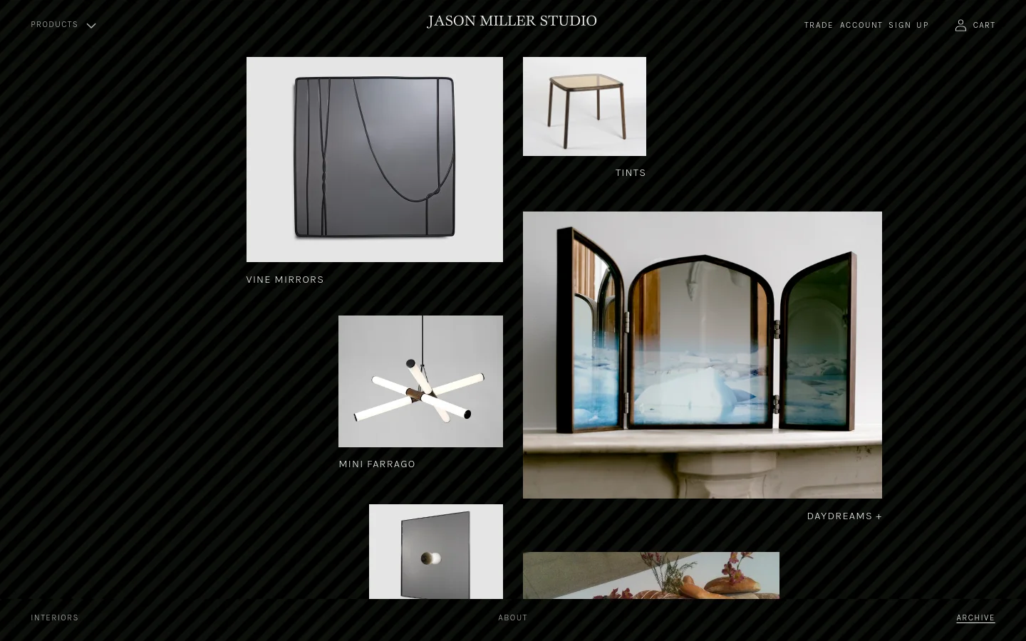 The Archive page features a grid layout of design project images against a dark, diagonally striped background. Each entry consists of a rectangular product photograph above its corresponding title, such as 'Vine Mirrors' and 'Tints'. The navigation menu is at the top with links for Products, Trade Account, and Cart.