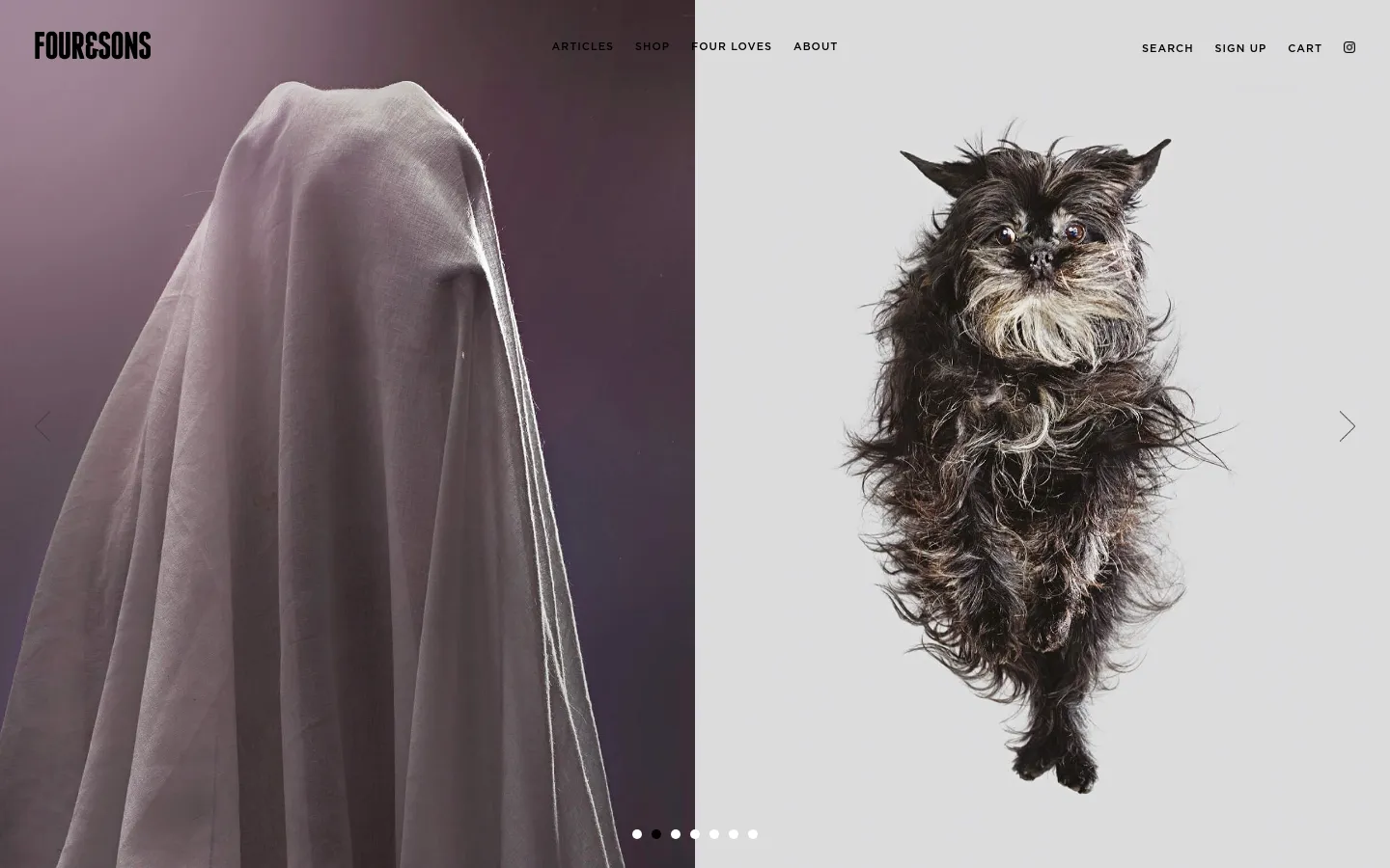 The desktop homepage features a split-screen hero image with a draped white cloth on the left and a fluffy black dog on the right against a light gray background. The 'FOUR&SONS' logo is in the top left, with a navigation menu including Articles, Shop, Four Loves, and About in the center, and Search, Sign Up, and Cart on the right. Below the hero, a section promotes 'Dog-Friendly' city guides with a large image of book covers and text describing the collaboration.