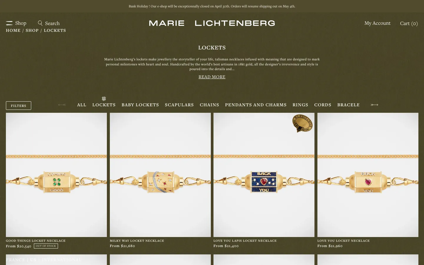 The desktop version of the Marie Lichtenberg Lockets collection page features a dark olive green background with white text. A centered hero section includes the brand name, a collection title, a brief description, and a 'READ MORE' link, followed by a horizontal navigation menu of jewelry categories and a grid of product images showcasing gold locket necklaces.