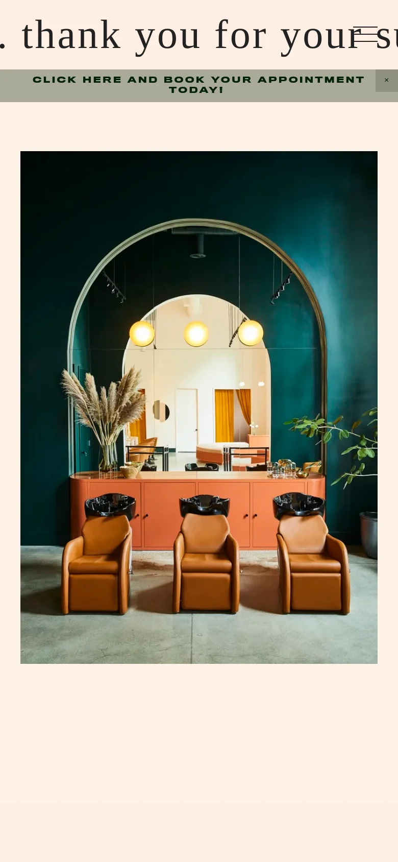 The mobile version maintains the cream background and centered text headline. The hero image of the salon interior is scaled down to fit the vertical screen, showing the teal walls, arched mirror, and tan leather chairs in a narrower aspect ratio.