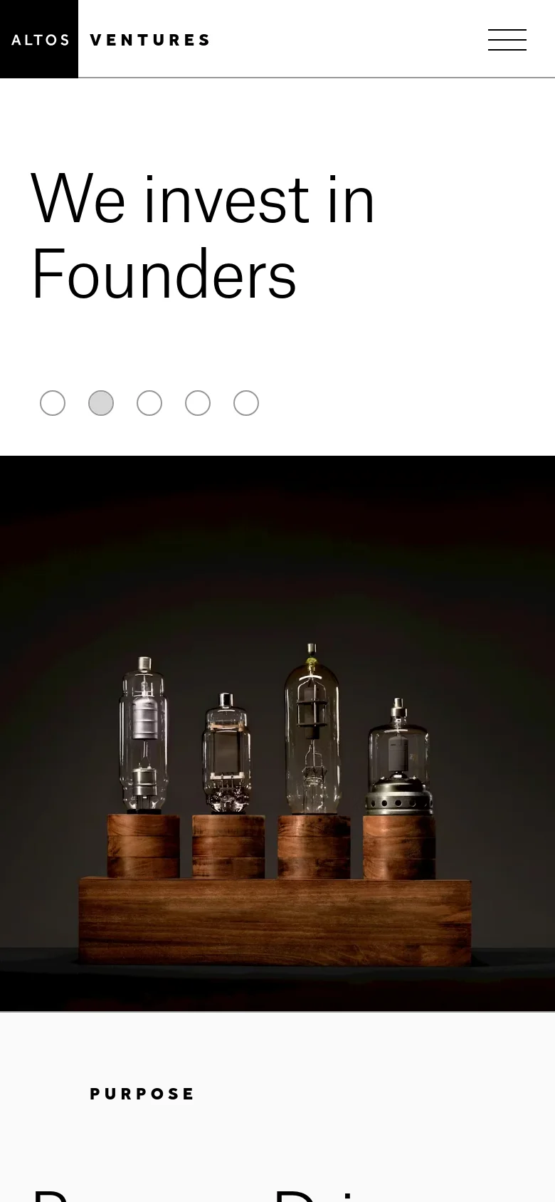 The mobile version transitions to a single-column vertical layout, stacking the hero imagery above the text content. The large headline 'We invest in Founders' is prominently displayed at the top, followed by a full-width image of glass laboratory equipment on wooden blocks. Navigation is condensed into a hamburger menu icon in the top right corner.