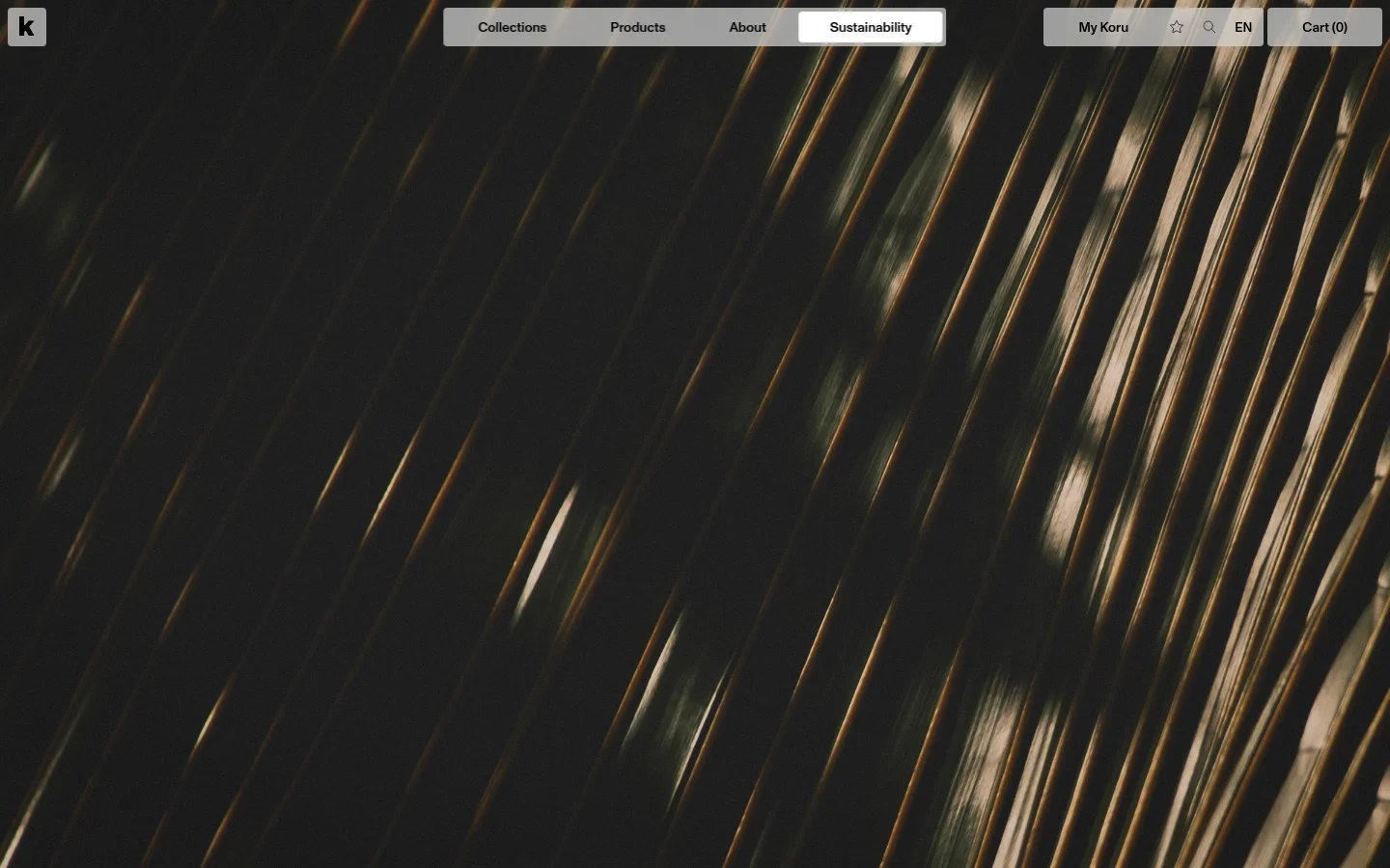 The desktop page features a minimalist design with a large hero image of textured natural fibers. A navigation bar at the top includes links for Collections, Products, About, and Sustainability, alongside user account and cart options. The layout uses ample white space and elegant typography against a dark, organic background.