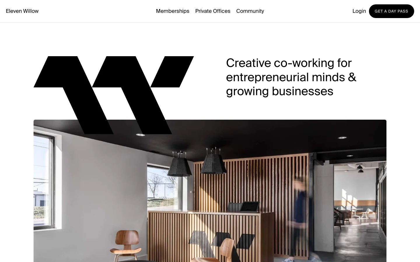 The desktop homepage features a minimalist white header with the Eleven Willow logo, navigation links, and a black 'GET A DAY PASS' button. The hero section displays a large black stylized 'W' logo next to the headline 'Creative co-working for entrepreneurial minds & growing businesses,' positioned above a wide photograph of a modern, sunlit reception area with wooden slat accents.