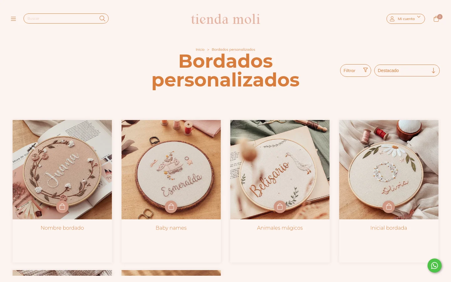 Desktop view of the 'Bordados personalizados' page on Tienda Moli, featuring a minimalist cream background and large terracotta-colored headline. A grid of four product cards displays embroidered hoop designs including names and animals, each with a small shopping bag icon overlay. The header includes a search bar, logo, account login, and a shopping cart icon.