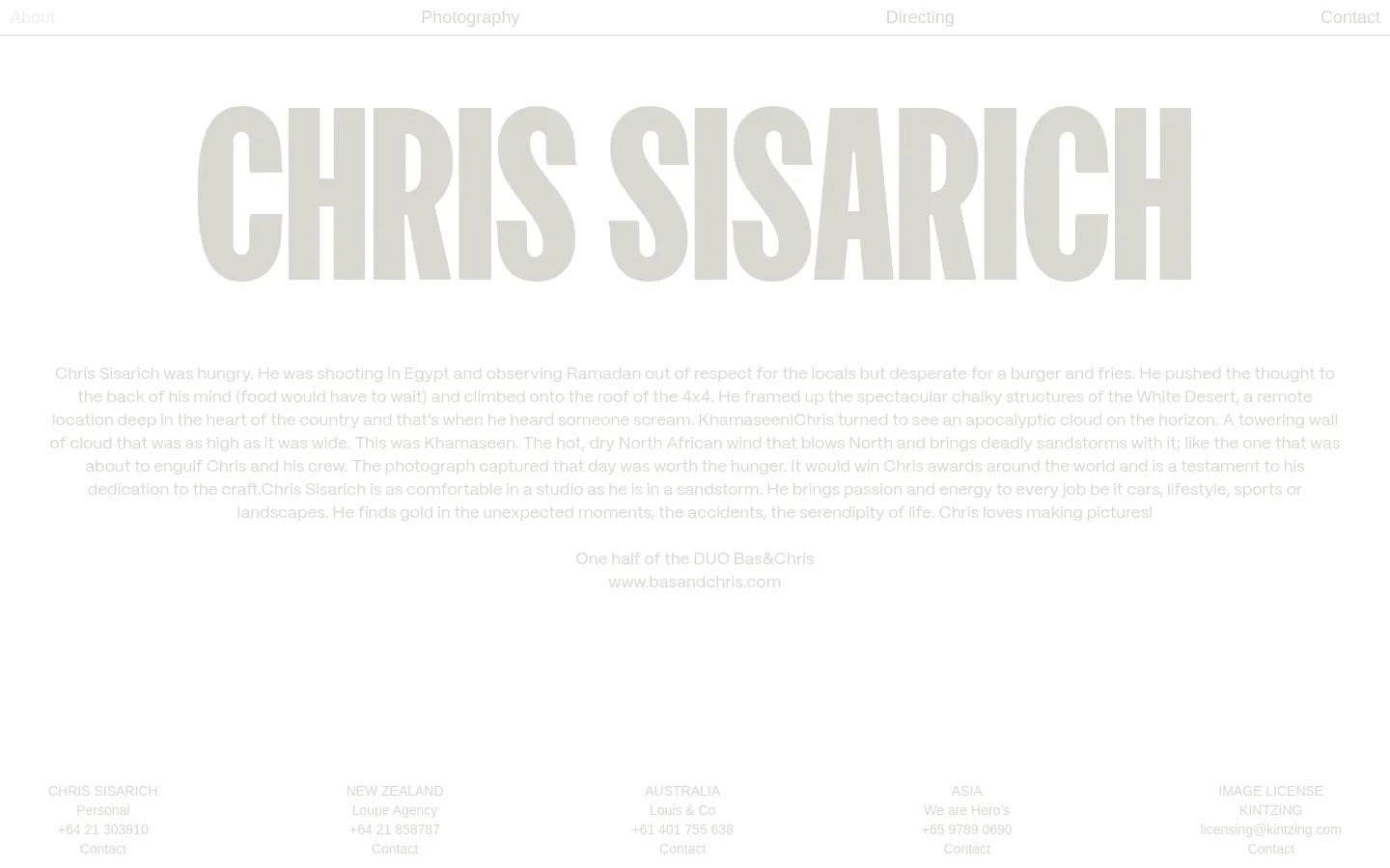 The desktop About page features a minimalist white background with large, light gray typography for the name 'CHRIS SISARICH' as a hero element. Below the headline, a biographical text block describes the photographer's experiences, followed by a multi-column layout of contact information for different regions and agencies. Navigation links are positioned at the top and bottom of the page.