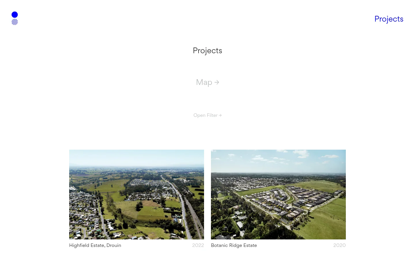 The Projects page features a clean, minimalist design with a white background and dark grey text. A large 'Projects' heading is centered above links for 'Map' and 'Open Filter', followed by a grid of large, high-quality aerial landscape photographs of property developments, each labeled with a project name and year.
